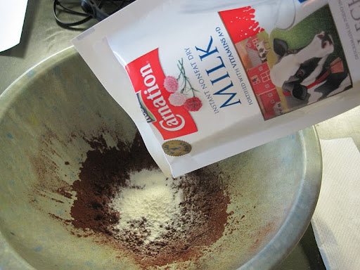 In goes the nonfat dry milk.