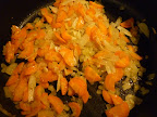 Onions, carrots, and garlic cook until tender and sweet.