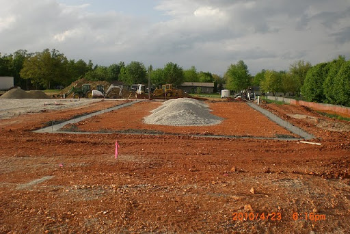 A pile of chat inside the boundary outline which eventually became the foundation of the Kingdom Hall. (Photo by Art Morris)