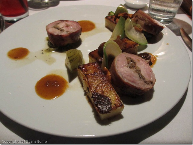 Rabbit rolled in bacon, with potato cakes, mushrooms, and root vegetables
