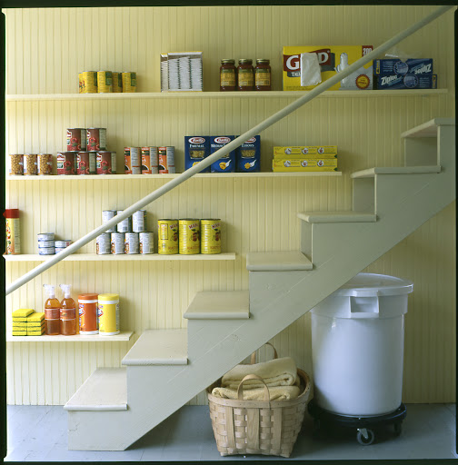 Narrow shelving installed along a stairway, like one leading to the basement, is perfect for storing cleaning products, trash bags, or other non-perishable goods. Narrow shelving installed along a stairway, like one leading to the basement, is perfect for storing cleaning products, trash bags, or other non-perishable goods.