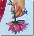 [Sita Devi holding a flower]