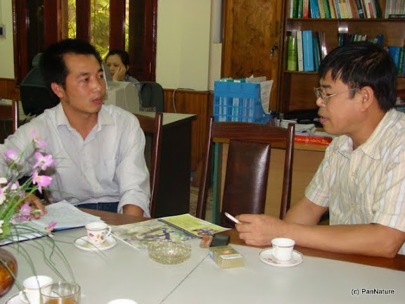 Consultation with the head of Conservation Section of Ha Giang Forest Protection Department on the design of Tonkin Snub-nosed Monkey poster.