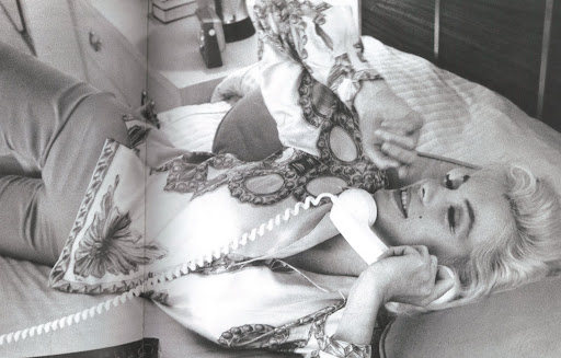 An intimate shot of Marilyn Monroe wearing a Pucci printed silk twill shirt in 1962, an example of his glamorous clientele list. An intimate shot of Marilyn Monroe wearing a Pucci printed silk twill shirt in 1962, an example of his glamorous clientele list.