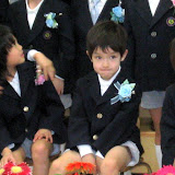 Kai waiting for the group photo to be taken at his kindergarten graduation