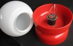 Lamp with red plastic base and glass dome