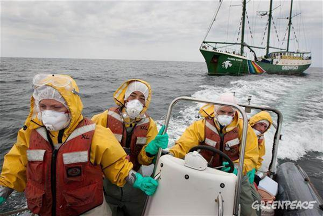 Collecting Samples near Fukushima. Left to right: Giorgia Monti of Greenpeace Italy (far left of pic), Sakyo Noda of Greenpeace Japan, Tuomas Heikkila (driving boat), Jacob Namminga (at rear of boat). Crew from the Rainbow Warrior collect sea water and seaweed samples to monitor for radiation contamination levels as the Greenpeace ship sails up the eastern coast of Japan, in the vicinity of Fukushima, 5 May 2011 &copy; Jeremy Sutton-Hibbert / Greenpeace