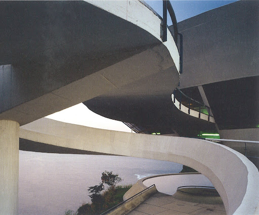 The color of the cement seems to contrast nicely with the pink-hued sea in the background. Niteroi Museum of Art, Oscar Niemeyer, Rio De Janiero, August 2003. The color of the cement seems to contrast nicely with the pink-hued sea in the background. Niteroi Museum of Art, Oscar Niemeyer, Rio De Janiero, August 2003.