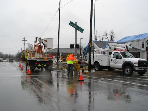 Crews work to repair traffic lights at the intersection of Cherokee Street and National Avenue in Springfield Wednesday.