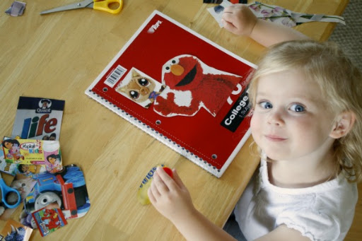 Once you have enough pictures to fill the front cover of your notebook, glue them on. They can be in a specific order or in a mishmash. If the kids want to use a lot of images, they can make them fit by overlapping the pictures.