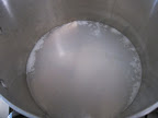 And she brings the pot to a gentle simmer for about 5 minutes, just until the fish is cooked through.