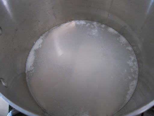 And she brings the pot to a gentle simmer for about 5 minutes, just until the fish is cooked through.