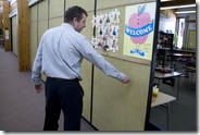Brunswick Junior High School Principal Walter Wallace knocks on one of the sixth grade classrooms' thin walls. "This is not very good for sound," he said." Brunswick Junior High School Principal Walter Wallace knocks on one of the sixth grade classrooms' thin walls. "This is not very good for sound," he said."
