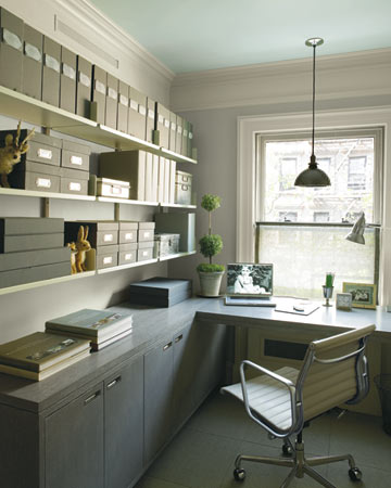 The custom L-shaped desk was created to hide equipment while affording a view.