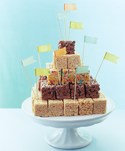 This is a wonderful example of how to stack different treats other than cake on top of a traditional stand. This is a wonderful example of how to stack different treats other than cake on top of a traditional stand.