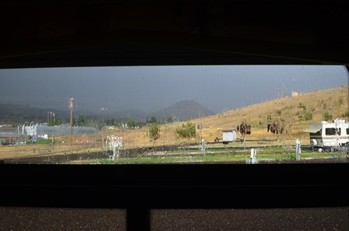 pouring rain, thunder and lightning, and sunshine at the Wheeler County Fairgrounds in Fossil