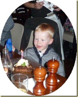 tommy with b'day cake tommy with b'day cake