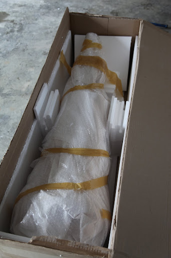 Now that all the hard work is done, we'll let Martha unwrap the rest.  Even though we're curious what is inside, it was, after all, addressed to her.