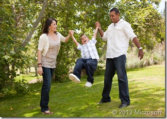 Young Family Having Fun in the Park Young Family Having Fun in the Park