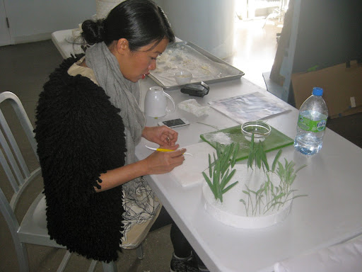 Katie making the leaves for the snow drops out of gum paste for the 