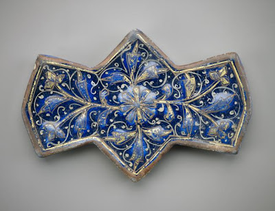 Polygonal tile | Origin:  Rayy,  Iran | Period: 1250-1300  Il-Khanid period | Details:  Not Available | Type: Stone-paste painted over turquoise glaze with gold | Size: H: 15.6  W: 10.4  cm | Museum Code: F1908.165 | Photograph and description taken from Freer and the Sackler (Smithsonian) Museums.