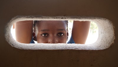 Eyes through cement wall taken by Evan Bartlett