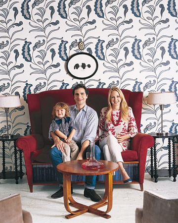 Rebecca Robertson and family sit in front of a wall -- covered in the Rebecca Robertson and family sit in front of a wall -- covered in the