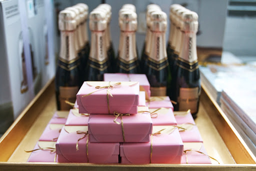 Favors: handcrafted boxes filled with chocolate balls, mini Champagne bottles (Chandon Brut Classic, $7) Favors: handcrafted boxes filled with chocolate balls, mini Champagne bottles (Chandon Brut Classic, $7)