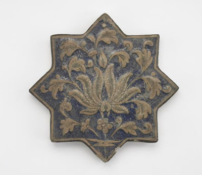 Tile | Origin:  Iran | Period: 14th century  Il-Khanid period | Details:  Not Available | Type: Stone-paste molded and painted under glaze | Size: H: 2.1  W: 20.3  cm | Museum Code: F1903.228 | Photograph and description taken from Freer and the Sackler (Smithsonian) Museums.