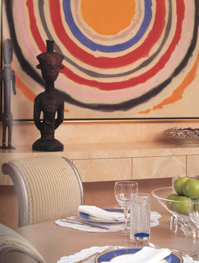 Silver-painted Classical Moderne chairs, once belonging to MGM's properties department and used in Fred Astaire and Ginger Rogers film Roberta, add a note of Hollywood glamour to a Palm Beach dining room by designer Geoffrey Bradfield. (Regency Redux, Rizzoli)