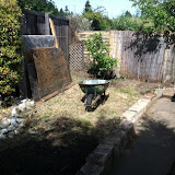 New, clean backyard. Making a place for the bricks (Can you tell I'm avoiding having to deal with the earthquake rubble in the back of the car?)