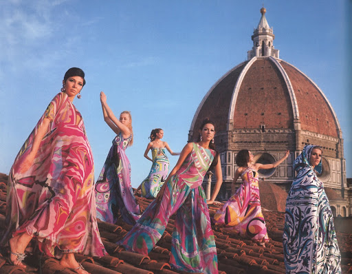 From the 1967 Spring/Summer collection, these models are on the roof of Palazzo Pucci wearing evening dresses, terrycloth capes, and palazzo pajamas. From the 1967 Spring/Summer collection, these models are on the roof of Palazzo Pucci wearing evening dresses, terrycloth capes, and palazzo pajamas.
