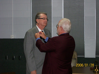 Pictured are: Don Patterson receiving the District Governor pin from now Past District Governor, Gary Welch.  Photo Courtesy of Susan Wellington, Rotarian