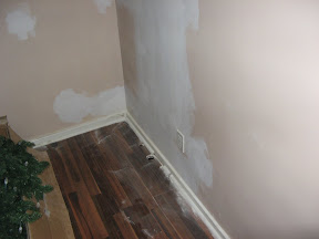 former location of washer/dryer. The entire wall needed work.