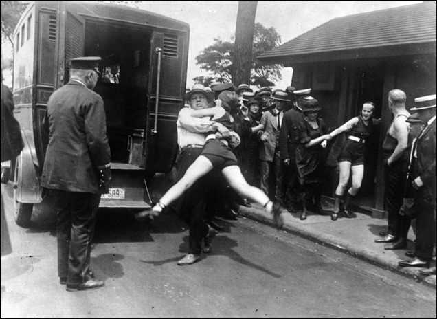 1922 - Women in Chicago being arrested for wearing one piece bathing suits and showing a little leg