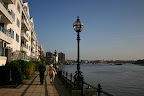 Mom and dad walking along the Thames