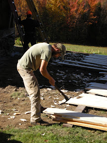 The tops of the siding boards are adzed down to fit into the boarding groove.