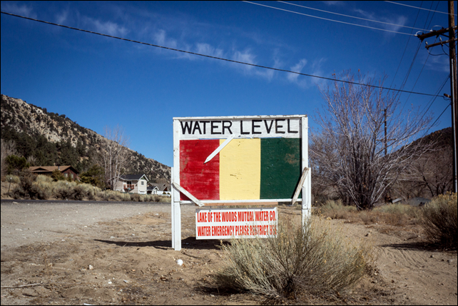 Lake of the Woods, a small community north of Los Angeles, is running dry amid a deep California drought. A sign announces the town's water levels. Residents are changing water habits, but many worry about the future. Photo: Matt Black / The New York Times