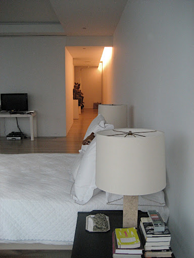 Looking back down the hallway from the living room to the front door.