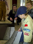 Demonstrating proper methods for installing roofing shingles