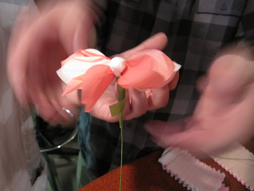 The stems get wrapped with floral tape to make them nice and smooth.  You can also twist the leaves onto the stem at this stage.