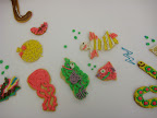 Our test kitchen was cooking salmon at the time and the smell of fish prompted many to create fish out of the Christmas cutouts. (At top left is the hook, but the worm has slipped off!)