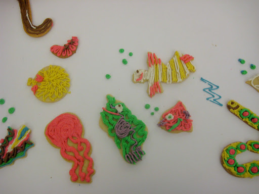 Our test kitchen was cooking salmon at the time and the smell of fish prompted many to create fish out of the Christmas cutouts. (At top left is the hook, but the worm has slipped off!)