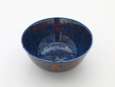 Bowl | Origin:  Iran | Period: 1650-1700  Safavid period | Details:  Not Available | Type: Stone-paste decorated with lustre over darl blue glaze | Size: H: 8.7  W: 18.9   D: 4.1  cm | Museum Code: F1908.115 | Photograph and description taken from Freer and the Sackler (Smithsonian) Museums.