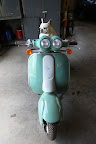 This machine was built by the italian motorcycle company Italjet.  Don't the headlamps give it lots of character?