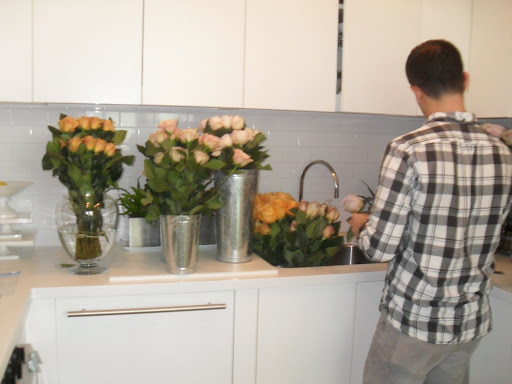 Use as much water as possible for most flowers (like roses) in a vase -- for soft-stem flowers use less water. A tip for tulips: the more water used the more the tulips will droop.