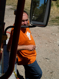 And then we stopped at a "beautiful vista" and the driver got out and smoked two cigarettes while we sat on a dirt road above a dry flood zone.