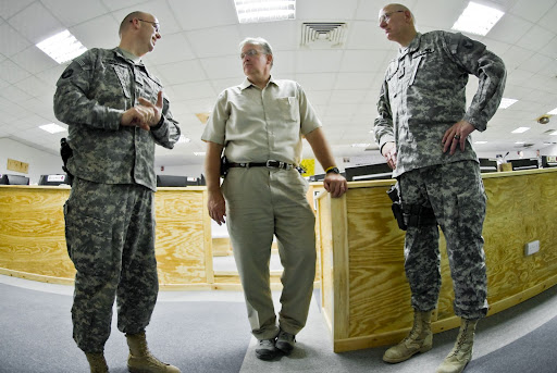 Missouri Gov. Jay Nixon is guided through a tour of the operations center of Multi-National Division-South headquarters by Brig. Gen.
Gerald Lang (right), deputy commanding general for support, MND-S and resident of Sauk Rapids, Minn., and Lt. Col. Chad Sackett (left), chief of operations, 34th Red Bull Infantry Division and resident of Forrest Lake, Minn. Nixon came to COB Basra as part of a three-governor tour which included Nevada Gov. Jim Gibbons and Minnesota Gov. Tim Pawlenty.
(U.S. Army photo by Spc. Tyler Maulding)