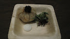 This is a fried dumpling filled with uni, a.k.a. sea urchin, and topped with caviar.  It sure beat theordinary shrimp-and-pork variety.