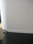 Here's the floor in place, in front of our lighter wall.